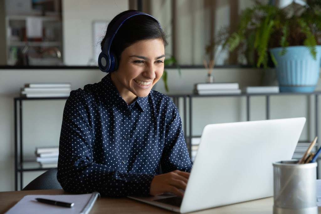 Head,Shot,Happy,Young,Indian,Ethnicity,Female,Manager,Wearing,Wireless Medicare Computer